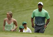 U.S. golfer Tiger Woods walks up to the green with his children Sam (2nd from R) and Charlie and his girlfiend Lindsey Vonn during the Par 3 event held ahead of the 2015 Masters at Augusta National Golf Course in Augusta, Georgia April 8, 2015. REUTERS/Phil Noble