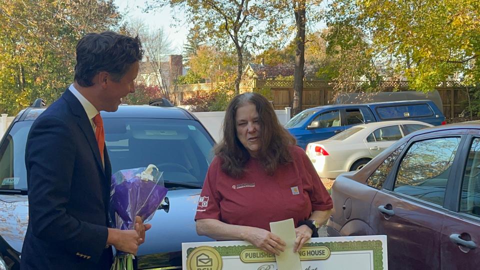 Lillian Trottier reacts to winning $15,000 after entering the Publishers Clearing House Sweepstakes