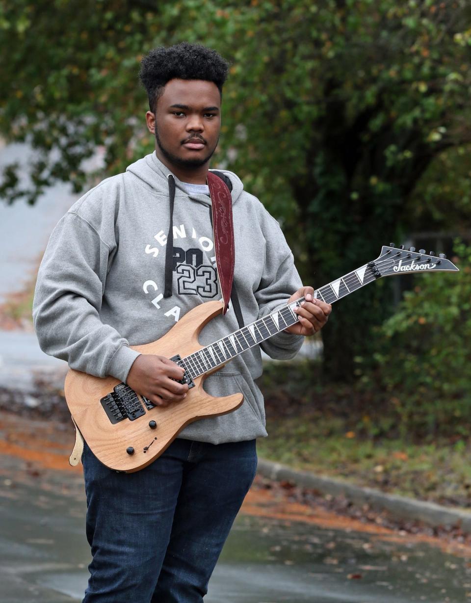 Musician Kadir Muhammad poses outside of the Gastonia Little Theater on Clay Street Friday afternoon, Nov. 11, 2022.