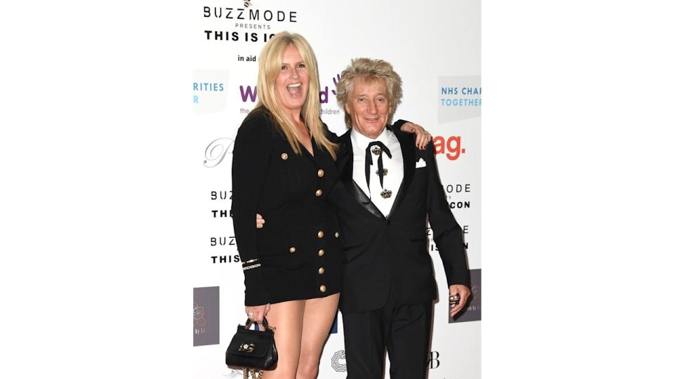 Penny Lancaster with arm around Rod Stewart