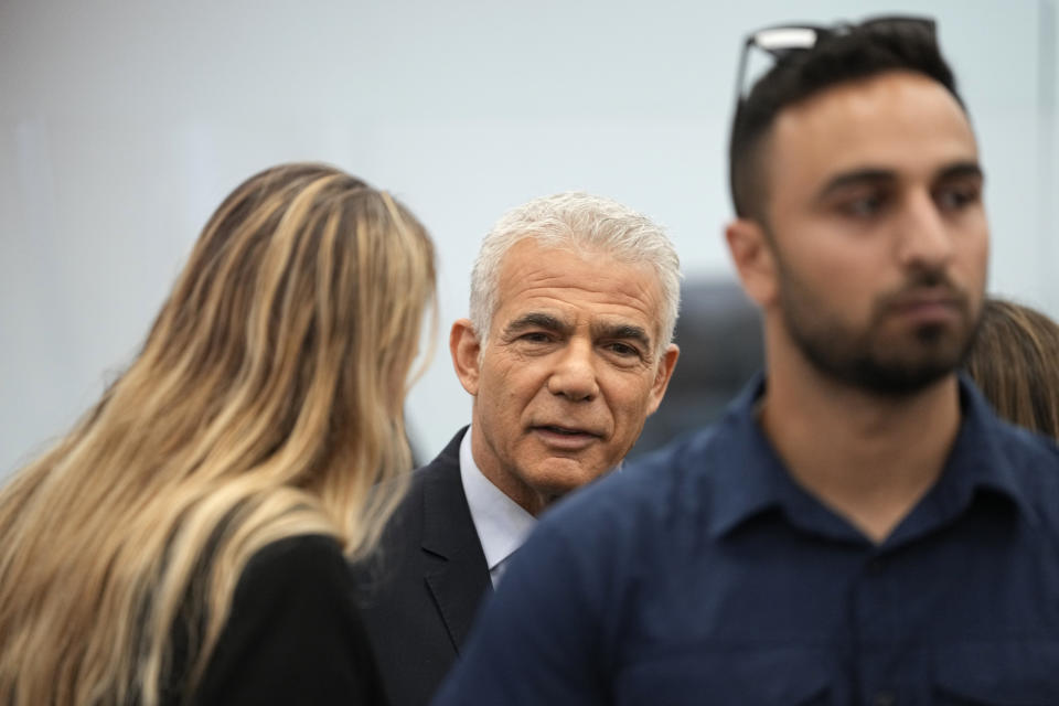 Israeli opposition leader Yair Lapid prepares to testify at the trial of Prime Minister Benjamin Netanyahu on corruption charges at the Jerusalem District Court, in east Jerusalem, Monday, June 12, 2023. (AP Photo/Ohad Zwigenberg)