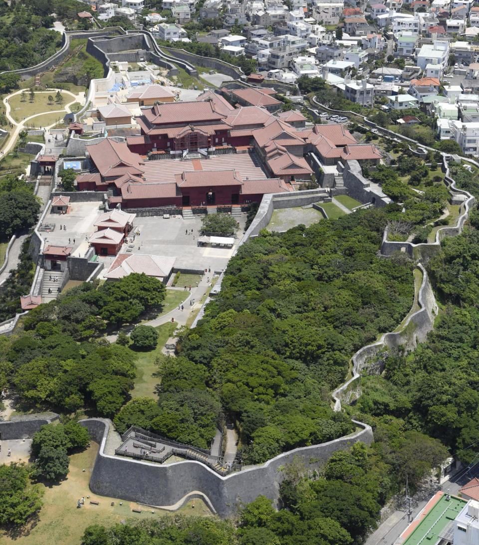 This May 2017, aerial photo shows Shuri Castle in Naha, Okinawa, southern Japan. A fire spread among structures at Shuri Castle on Thursday, Oct. 31, 2019, on Japan's southern island of Okinawa, nearly destroying the UNESCO World Heritage site. (Kyodo News via AP)