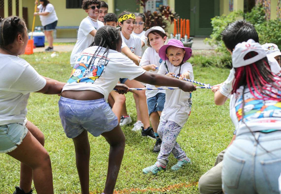 Natalia, at center, is among those playing tug-of-war at Camp U.O.T.S. on July 23.