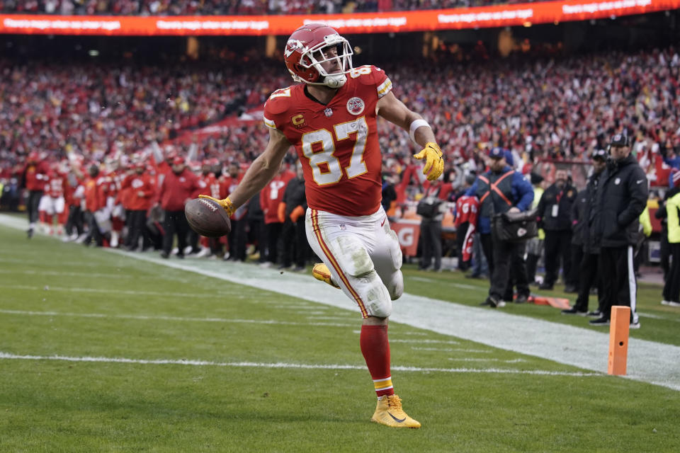 Kansas City Chiefs tight end Travis Kelce scores a touchdown against the Jacksonville Jaguars during an NFL Divisional Playoff football game Saturday, Jan. 21, 2023, in Kansas City, Mo. (AP Photo/Ed Zurga)