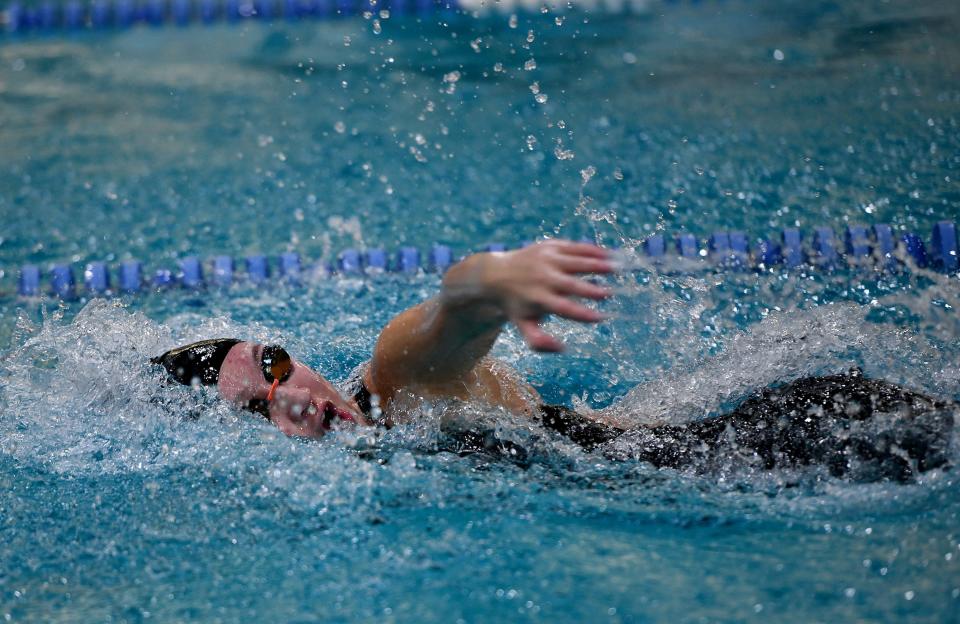 Westborough's Caitlyn Reitsma wins the 100 freestyle at the Mid-Wach League swimming championships at Tantasqua Regional High School.