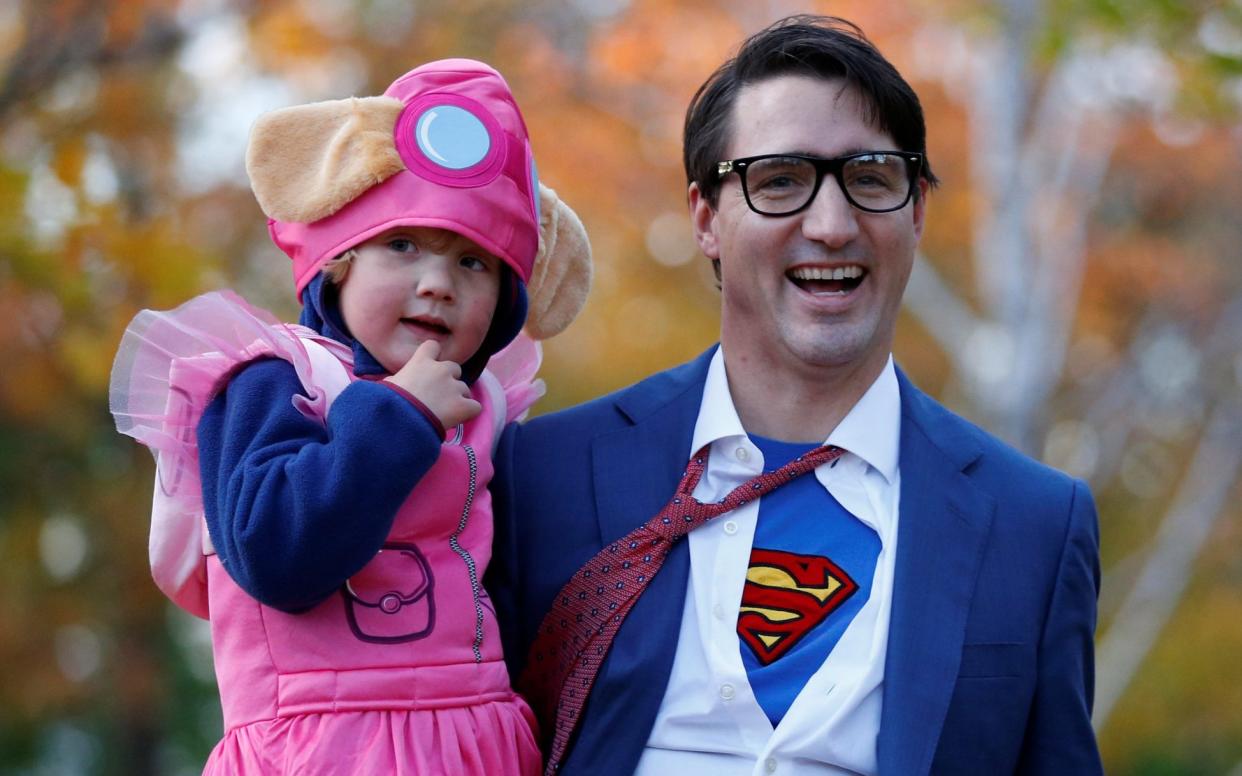 Canada's Justin Trudeau dresses as Clark Kent for Halloween - REUTERS