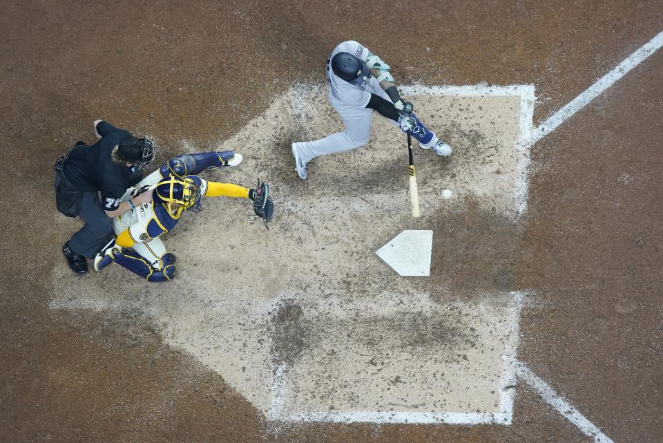 New York Yankees' Gleyber Torres hits an RBI single during the sixth inning of a baseball game against the Milwaukee Brewers Sunday, April 28, 2024, in Milwaukee. (AP Photo/Morry Gash)