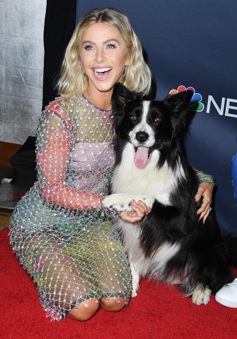 Julianne Hough cuddles with a pup on the <em>America’s Got Talent</em> season 14 live show red carpet on Tuesday at the Dolby Theatre in Hollywood.