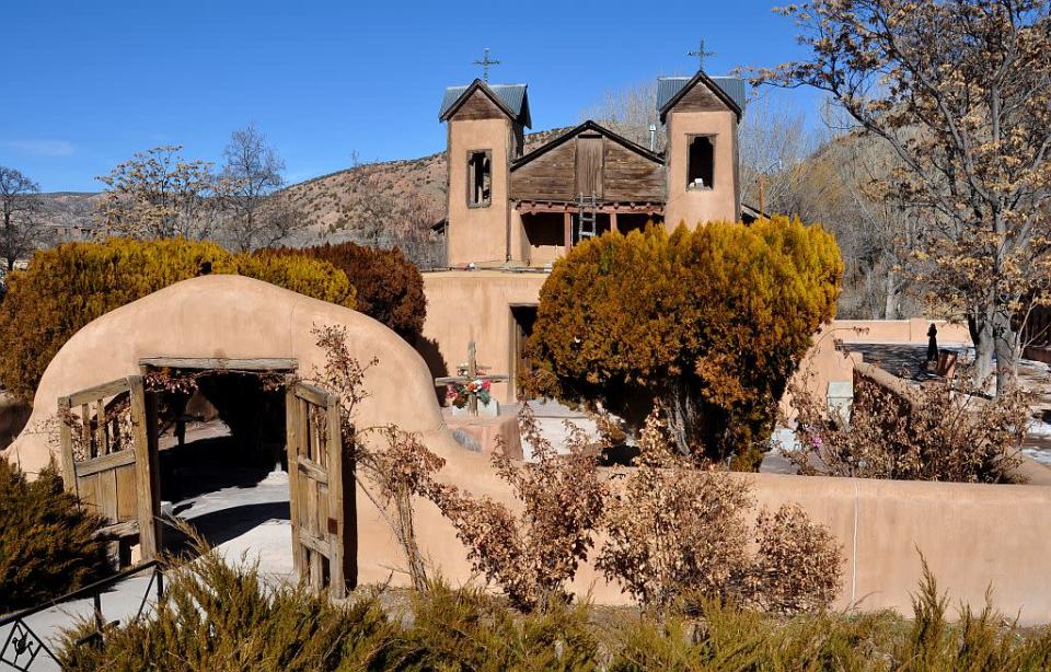 The Santuario de Chimayo is a Roman Catholic church in Chimayo, New Mexico, built by Spanish missionaries in 1816. The shrine, a National Historic Landmark, is famous as a contemporary pilgrimage site where many visitors take a small amount of "holy dirt" in hopes of a miraculous cure for themselves or a loved one.