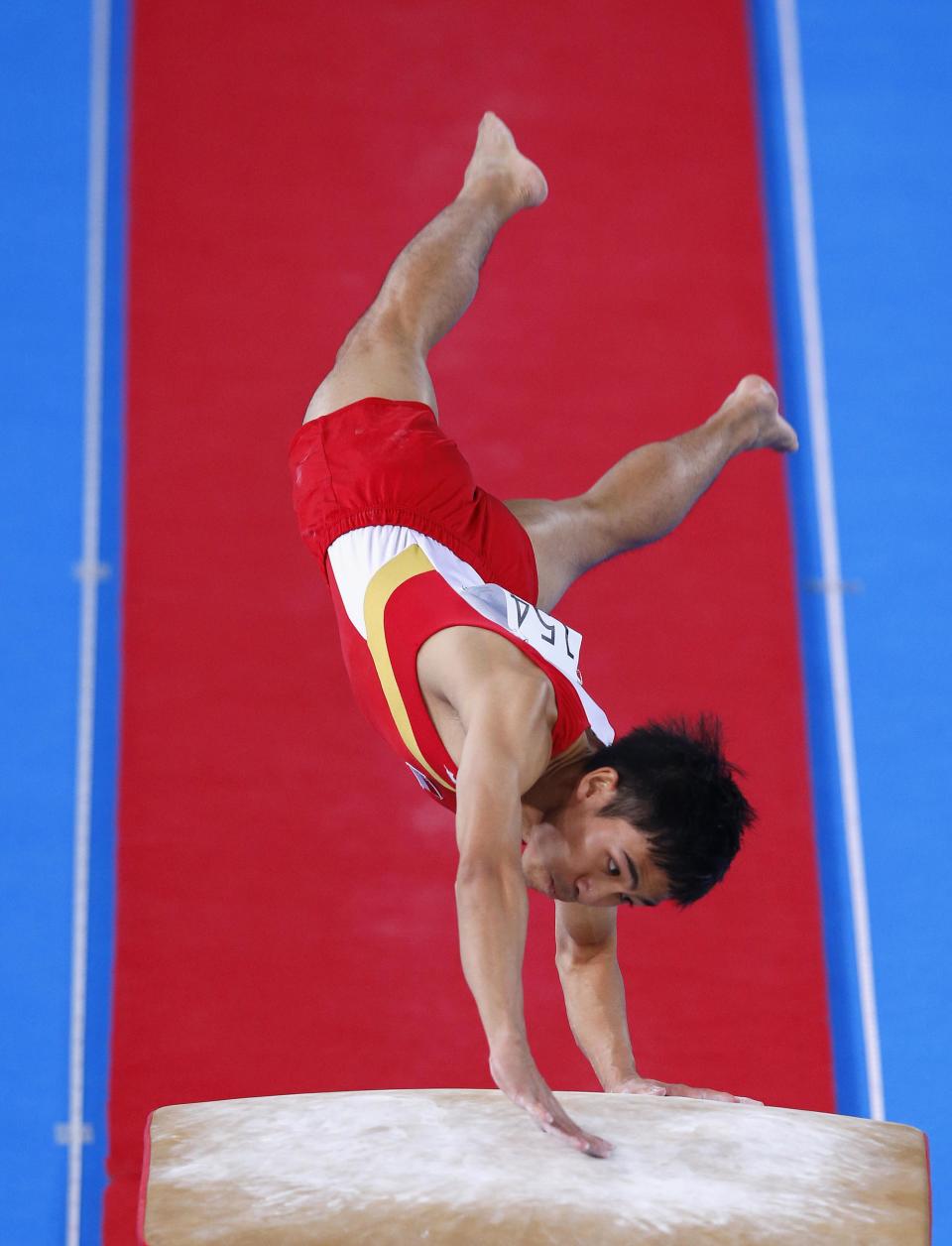 Hoe performs a vault during the gymnastics apparatus final at the Commonwealth REUTERS/Phil Noble