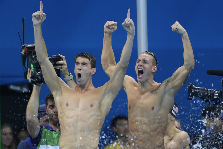 Michael Phelps (left) and Caeleb Dressel celebrate a win in the 4x100m freestyle relay (Getty)