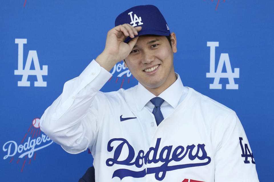 Los Angeles Dodgers' Shohei Ohtani smiles during a baseball news conference at Dodger Stadium Thursday, Dec. 14, 2023, in Los Angeles. (AP Photo/Ashley Landis)