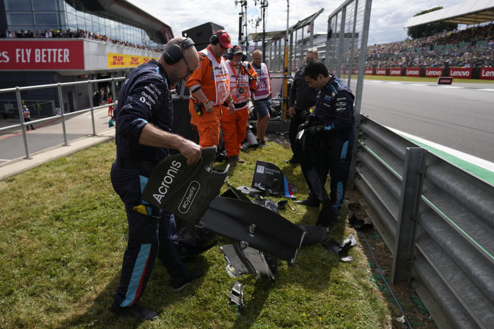 Debris from broken cars is collected during the British Formula One Grand Prix at the Silverstone circuit, in Silverstone, England, Sunday, July 3, 2022. (AP Photo/Matt Dunham, Pool)