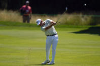 Patrick Cantlay hits an approach shot on the fourth hole during the third round of the Travelers Championship golf tournament at TPC River Highlands, Saturday, June 25, 2022, in Cromwell, Conn. (AP Photo/Seth Wenig)