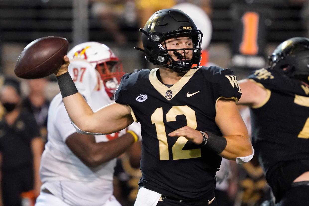 Wake Forest quarterback Mitch Griffis (12) looks to pass against VMI during the second half of an NCAA college football game in Winston-Salem, N.C., Thursday, Sept. 1, 2022. (AP Photo/Chuck Burton)