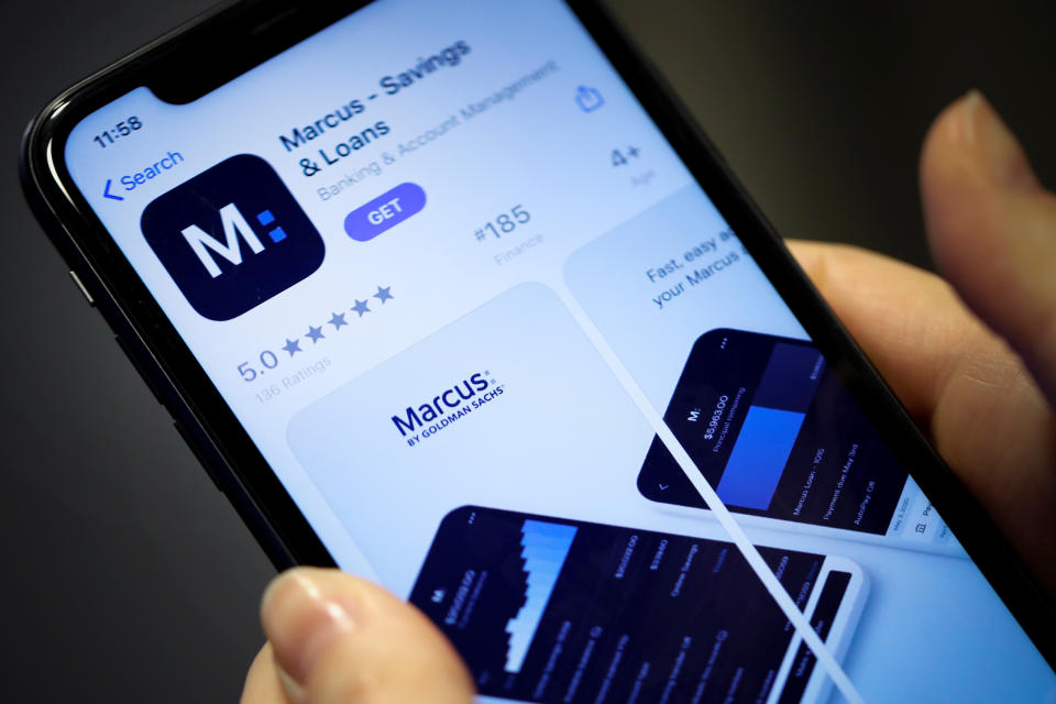 A woman looks at Marcus, a new savings and loans app recently launched by Goldman Sachs in New York, U.S., January 10, 2020. REUTERS/Mike Segar