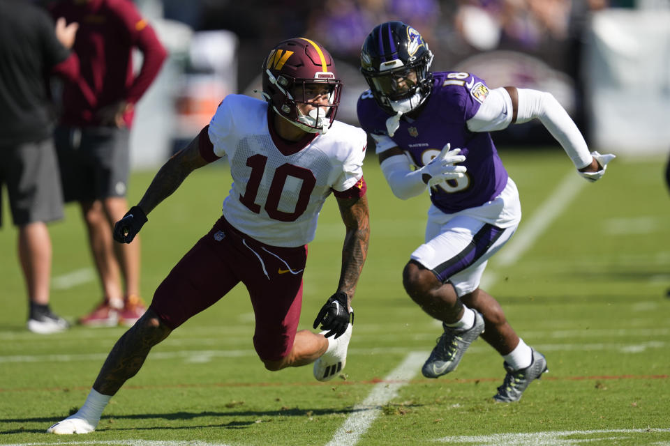 Washington Commanders wide receiver Kazmeir Allen (10) runs a route against Baltimore Ravens wide receiver <a class="link " href="https://sports.yahoo.com/nfl/players/40642" data-i13n="sec:content-canvas;subsec:anchor_text;elm:context_link" data-ylk="slk:Dontay Demus Jr.;sec:content-canvas;subsec:anchor_text;elm:context_link;itc:0">Dontay Demus Jr.</a> (18). (AP Photo/Julio Cortez) 