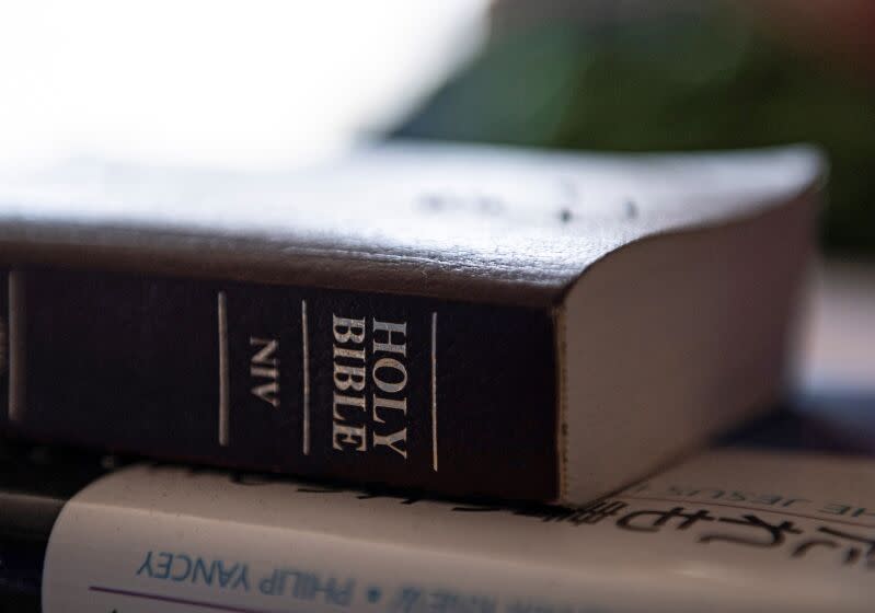 This picture taken on February 27, 2021 shows a copy of a Bible at an abandoned residential area of the old Fukushima First Bible Baptist Church inside the exclusion zone in Tomioka, Fukushima Prefecture - an area declared a no-go zone after the 2011 nuclear disaster. - Ten years after a powerful earthquake triggered a tsunami that overwhelmed the cooling systems at the nearby Fukushima Daiichi plant, sending it into meltdown, the Fukushima First Bible Baptist Church is a hollow shell. - TO GO WITH Japan-tsunami-anniversary-earthquake-nuclear-disaster-church-religion-Christianity,FOCUS by Shingo Ito (Photo by Philip FONG / AFP) / TO GO WITH Japan-tsunami-anniversary-earthquake-nuclear-disaster-church-religion-Christianity,FOCUS by Shingo Ito (Photo by PHILIP FONG/AFP via Getty Images)