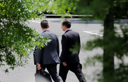 FBI Director Christopher Wray arrives at the West Wing of the White House for a meeting with U.S. President Donald Trump, Deputy Attorney General Rod Rosenstein and Director of National Intelligence Dan Coats on FBI investigations into the 2016 Trump presidential campaign at the White House in Washington, U.S., May 21, 2018. REUTERS/Carlos Barria