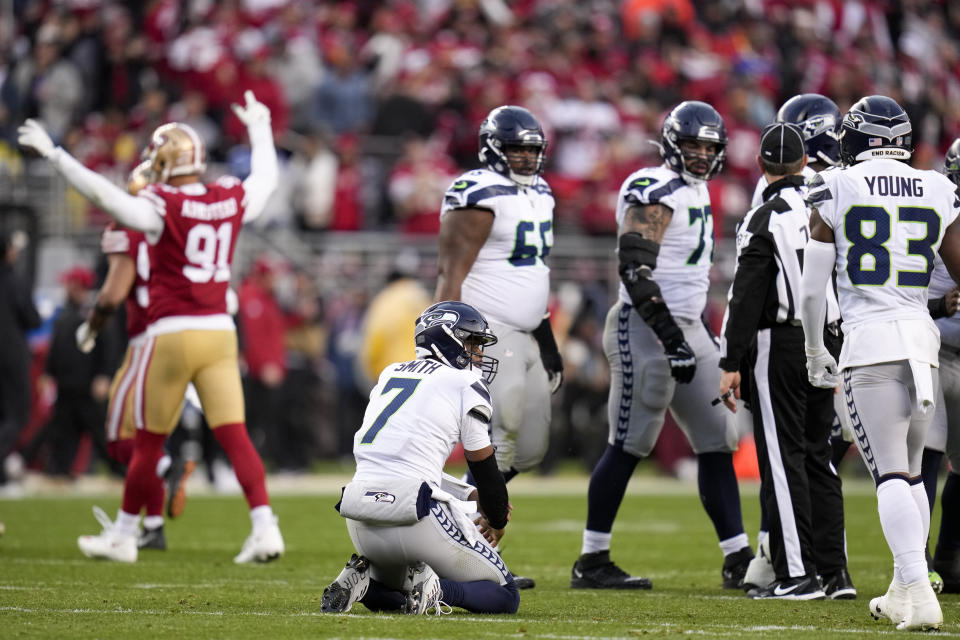 Seattle Seahawks quarterback Geno Smith (7) reacts after losing a fumble against the San Francisco 49ers during the second half of an NFL wild card playoff football game in Santa Clara, Calif., Saturday, Jan. 14, 2023. (AP Photo/Godofredo A. Vásquez)