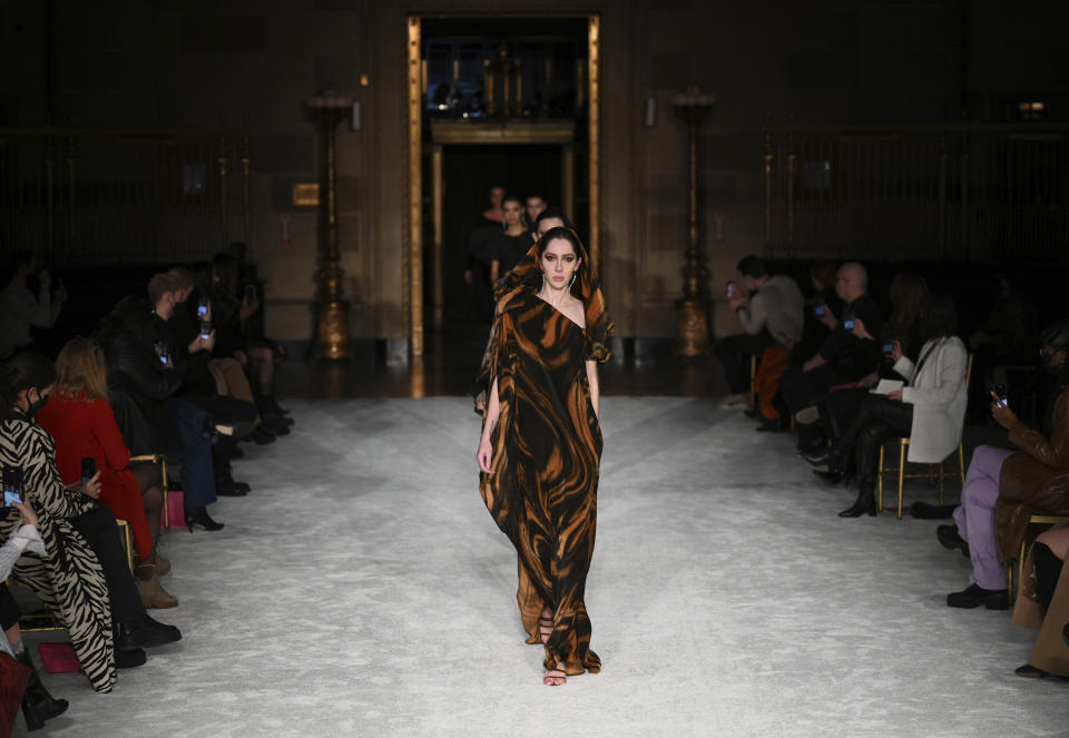 Models walk the runway at the Christian Siriano Fall/Winter 2021 at Gotham Hall during New York Fashion Week on Thursday, Feb. 25, 2021, in New York. (Photo by Evan Agostini/Invision/AP)