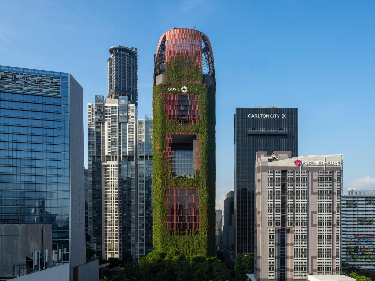 Oasia Hotel, located in central Singapore, has a facade that's intentionally overrun with plants.