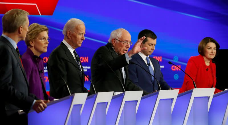 FILE PHOTO: Democratic 2020 U.S. presidential candidates Tom Steyer, Elizabeth Warren, Joe Biden, Bernie Sanders, Pete Buttigieg and Amy Klobuchar participate in the seventh Democratic 2020 presidential debate in Des Moines