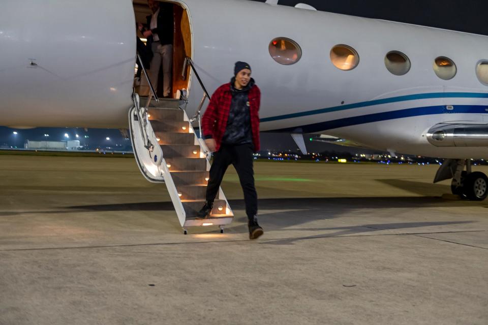 Brittney Griner deboards the plane and takes her first steps back on US soil.