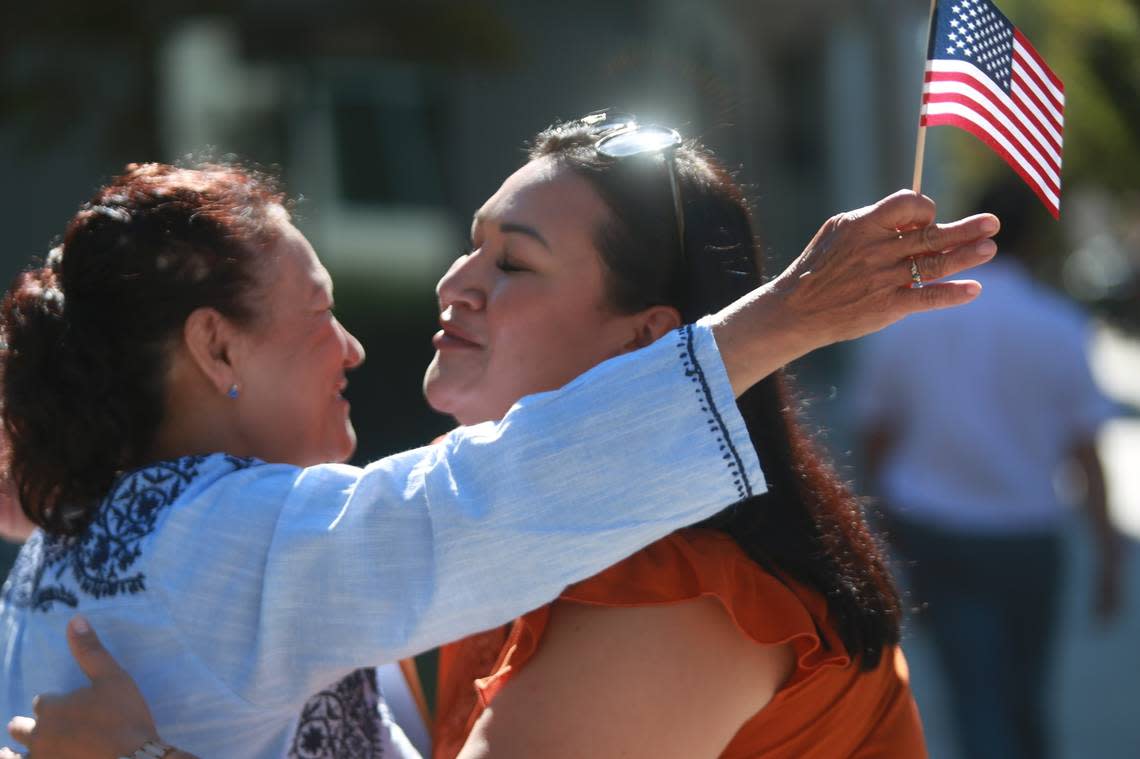 Jéssica Rodríguez embraces her mother Mercedes Heredia who became a US citizen Thursday (Sept. 22) at the offices of the United States Citizenship and Immigration Services in Fresno.