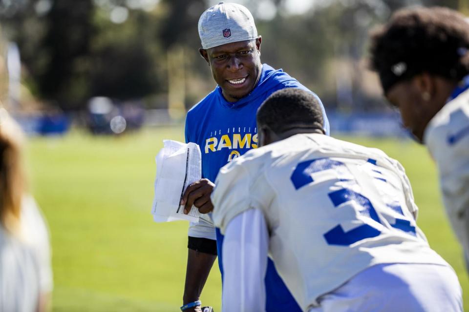 Rams defensive coordinator Raheem Morris talks to players during training camp in July 2021.