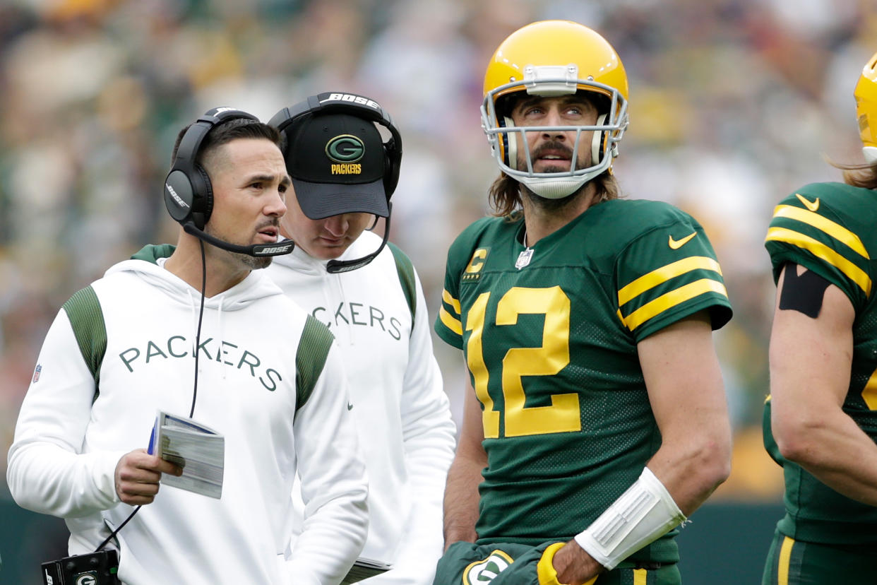 GREEN BAY, WISCONSIN - OCTOBER 24: Aaron Rodgers #12 talks with Green Bay Packers head coach Matt LaFleur during the game against the Washington Football Team at Lambeau Field on October 24, 2021 in Green Bay, Wisconsin. Green Bay defeated Washington 24-10. (Photo by John Fisher/Getty Images)