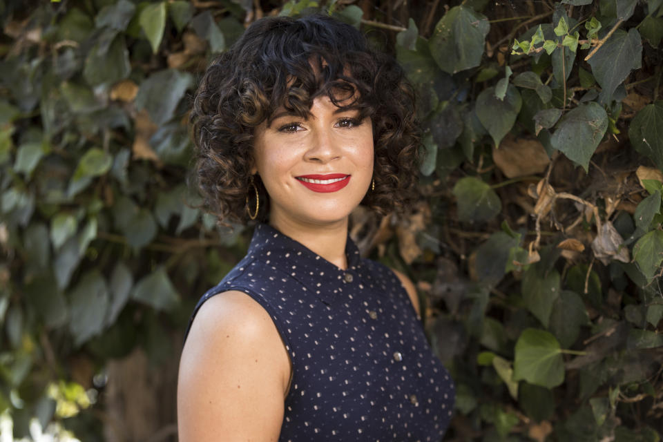 Charise Castro Smith poses for a portrait on Sept. 9, 2021, in Los Angeles to promote her Disney animated film "Encanto." The film, which she co-directs with Jared Bush and Byron Howard, is set in Colombia and follows a teenage girl dealing with the frustration of being the only member of her family without magical powers. (Photo by Willy Sanjuan/Invision/AP)