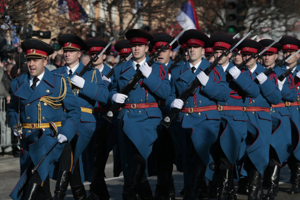 Members of the police forces of the Republic of Srpska march during a parade marking the 27th anniversary of the Republic of Srpska in the Bosnian town of Banja Luka, Wednesday, Jan. 9, 2019. In a show of nationalist defiance, Bosnian Serbs are celebrating a controversial holiday despite strong opposition from other ethnic groups in Bosnia who view it as discriminatory. Waving Serb flags, several thousand people on Wednesday lined up in the main Serb city of Banja Luka to watch a celebratory parade of security troops, firefighters, cultural and sport groups. (AP Photo/Amel Emric)