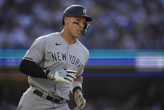 Yankees' Judge knocks open bullpen door while making running catch