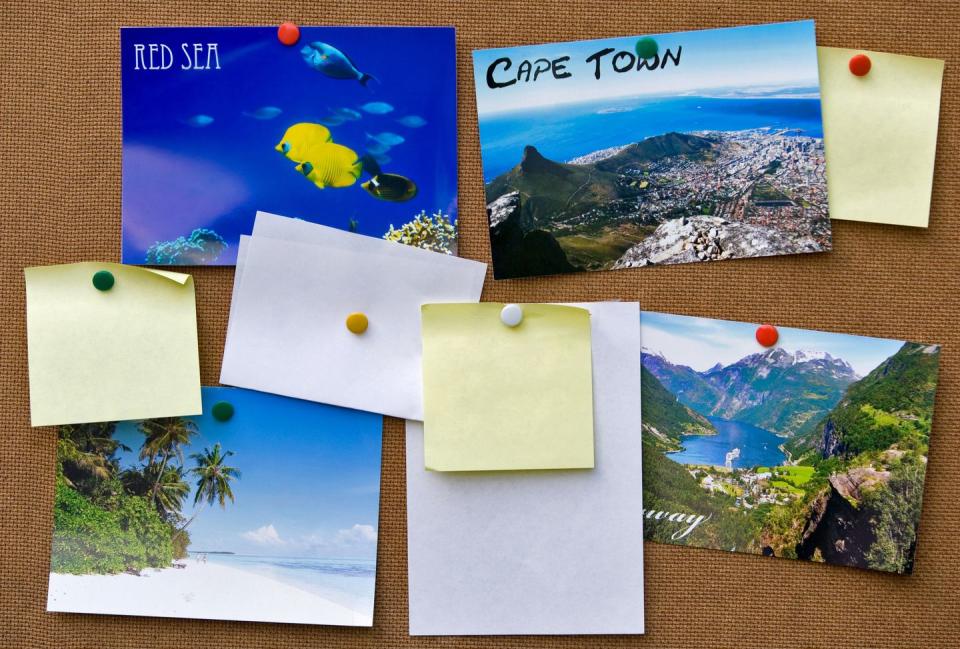 summer activities pinboard with postcards and sticky notes