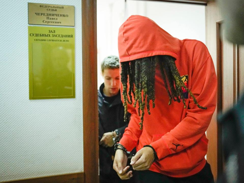 Brittney Griner appears in handcuffs during a May 13 hearing outside of Moscow.