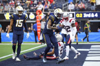 Los Angeles Chargers wide receiver Keenan Allen celebrates after a touchdown catch during the first half of an NFL football game against the New England Patriots Sunday, Oct. 31, 2021, in Inglewood, Calif. (AP Photo/John McCoy)