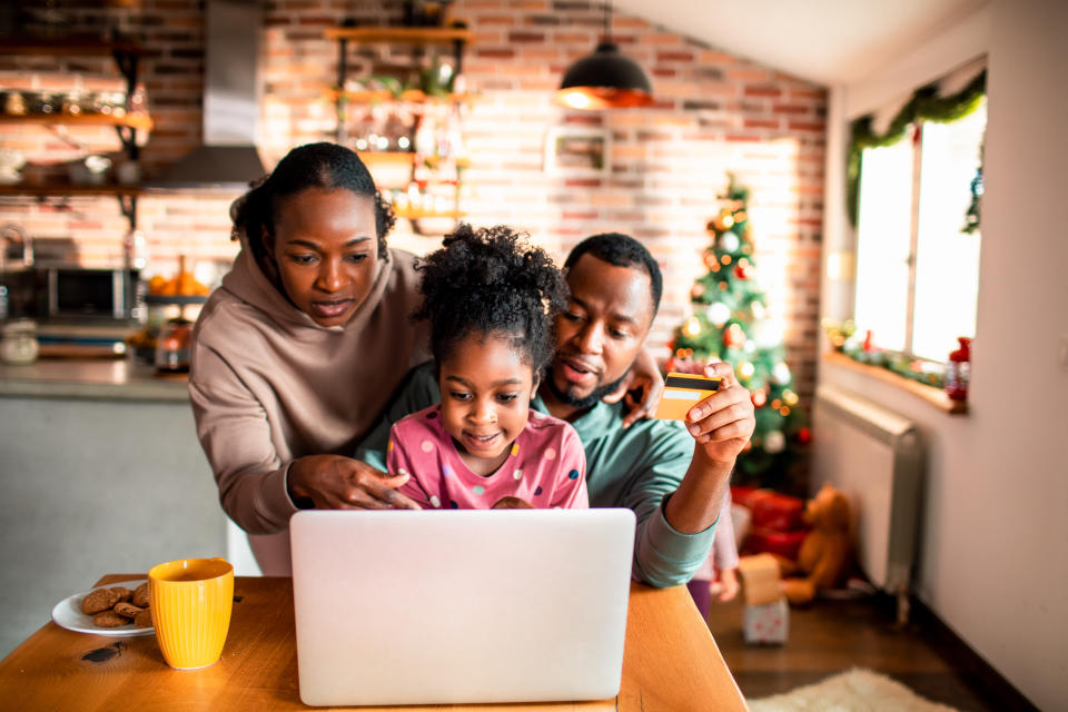 Close up of a young family doing some online Christmas shopping