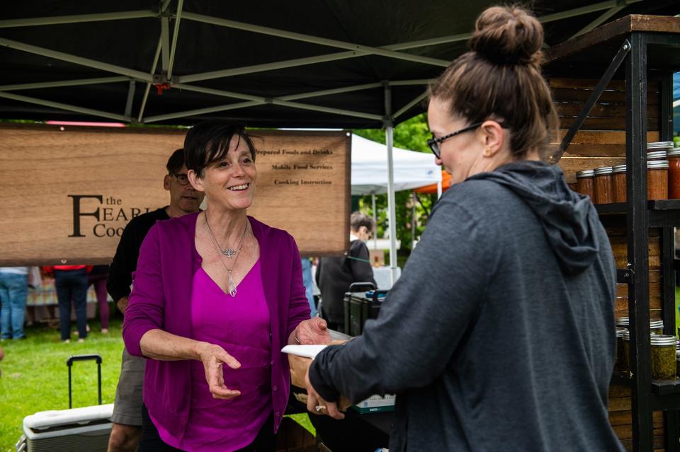 Jodie Rocchio, owner of the The Fearless Cooking Company, helps a customer at the Goshen Farmers Market in Goshen, NY on Friday, May 20, 2022. KELLY MARSH/FOR THE TIMES HERALD-RECORD