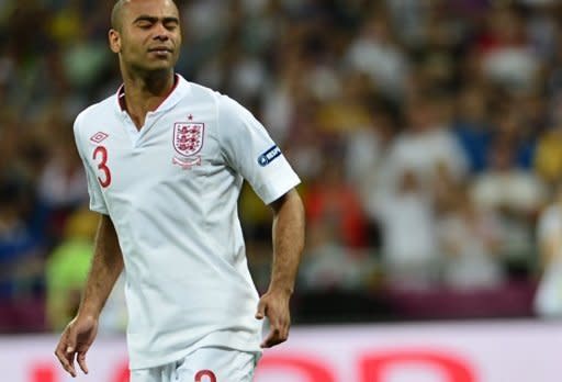 English defender Ashley Cole reacts after missing his shot during the penalty shoot out of the Euro 2012 football championships quarter-final match England vs Italy at the Olympic Stadium in Kiev. England's penalty curse struck again here Sunday as Italy advanced to the semi-finals of Euro 2012 with victory in a shoot-out after a tense quarter-final duel finished 0-0 following extra-time