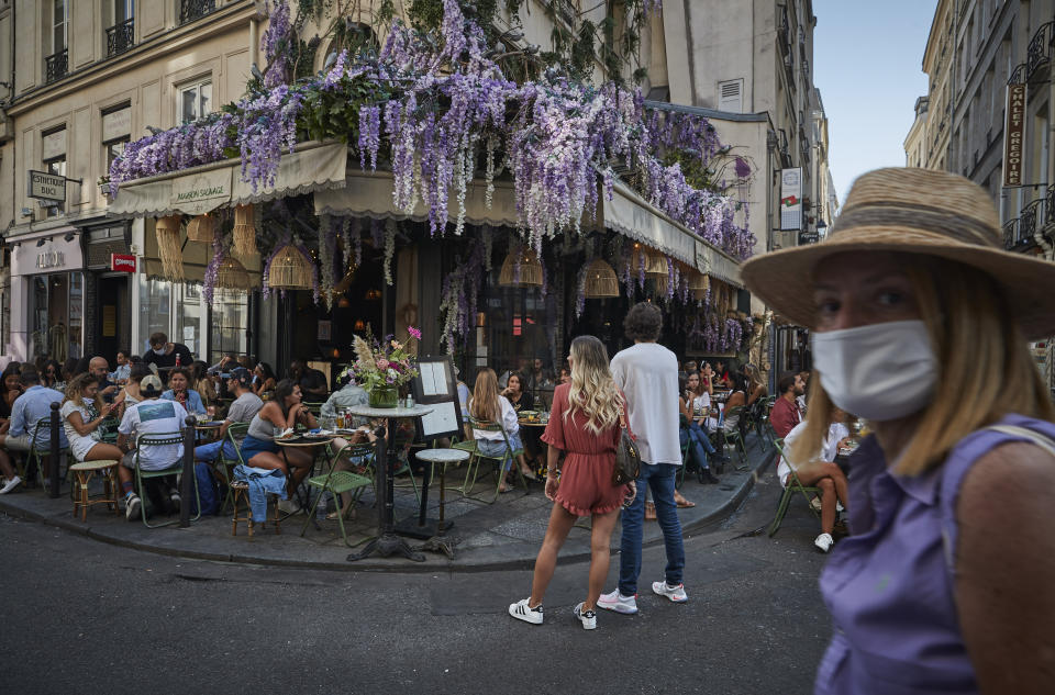 PARIS, FRANCE - SEPTEMBER 13: Parisians enjoy the late summer weather in packed cafes and restaurants on the Rue de Buci, Paris, despite the recent surge in Covid-19 infections throughout Paris and France on September 13, 2020 in Paris, France. On Saturday, the number of new daily cases in France exceeded 10,000, with infection rates rising among all age groups. (Photo by Kiran Ridley/Getty Images)