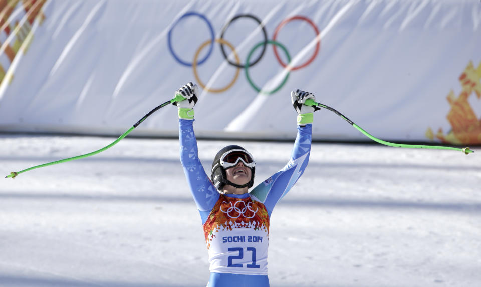 Slovenia's Tina Maze celebrates after finishing in the women's downhill at the Sochi 2014 Winter Olympics, Wednesday, Feb. 12, 2014, in Krasnaya Polyana, Russia. (AP Photo/Gero Breloer)