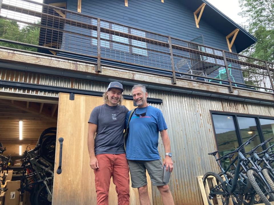 Jonny Adler, left, founder of the Madbush Falls restaurant/bar/hotel, and Marc Sherman, founder of the Riders Outpost bike shop, stand outside the Waitsfield businesses Aug. 17, 2023.