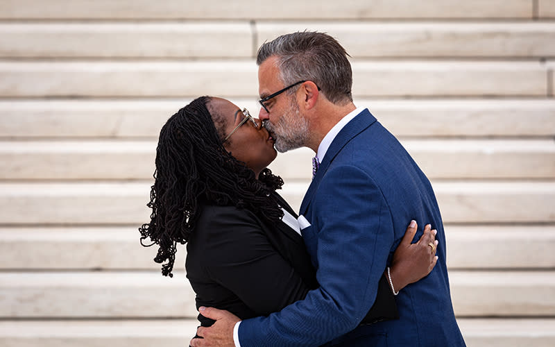 Justice Ketanji Brown Jackson kisses her husband outside the Supreme Court