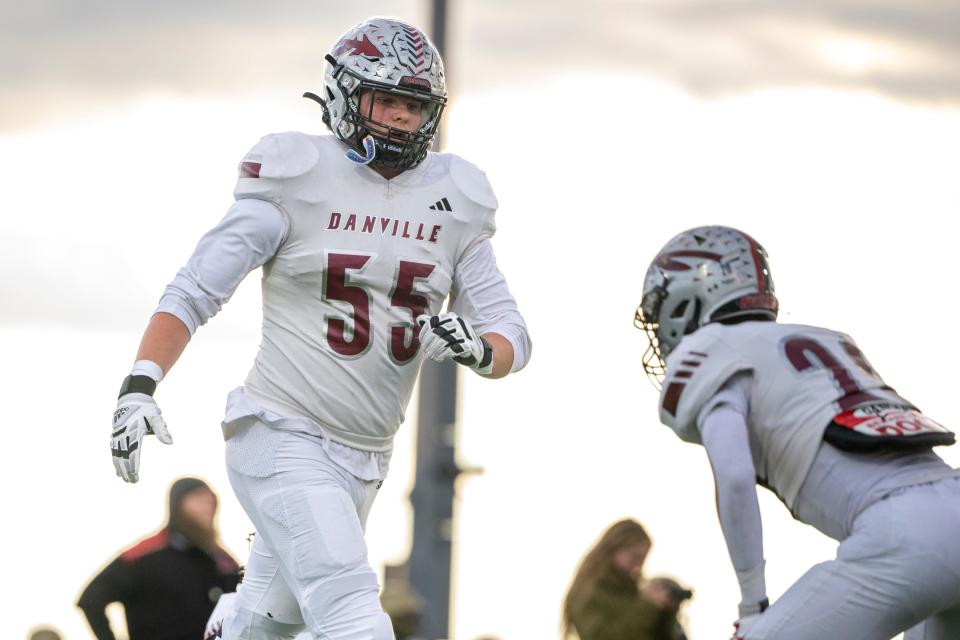 Danville Community High School senior Evan Lawrence (55) warms up on the field before the start of an IHSAA varsity football game against Tri-West Hendricks High School, Friday, Oct. 20, 2023, at Tri-West Hendricks High School.