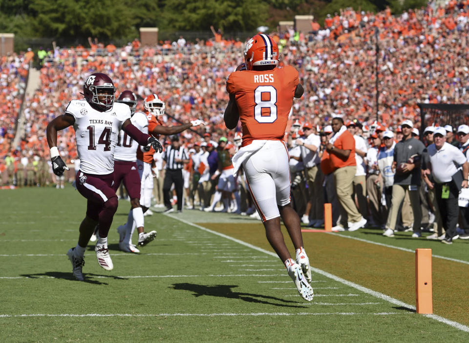 Clemson's Justyn Ross (8) catches a pass for a touchdown while defended by Texas A&M's Keldrick Carper during the first half of an NCAA college football game Saturday, Sept. 7, 2019, in Clemson, S.C. (AP Photo/Richard Shiro)