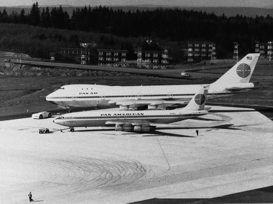 FILE - This Jan. 1970 file photo shows Pan American's Boeing 747 jumbo jet, rear, next to a smaller airliner. For decades, the Boeing’s 747 was the Queen of the Skies. But the glamorous double-decker jumbo jet that revolutionized air travel and shrunk the globe could be nearing the end of the line. (AP Photo, File)