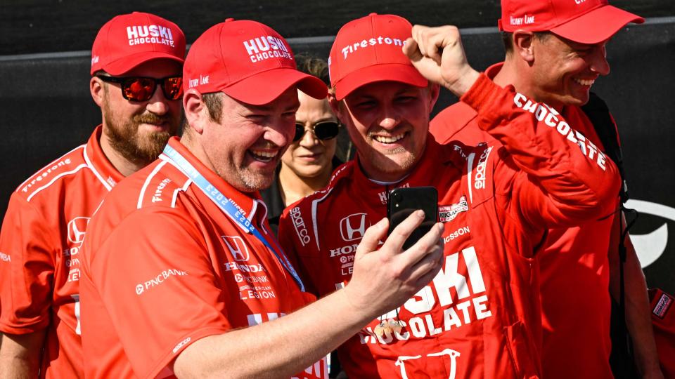 <em>Brad Goldberg and Marcus Ericsson share a moment FaceTiming with Goldberg’s family after their victory in St. Petersburg to open the 2023 season (Chip Ganassi Racing).</em>
