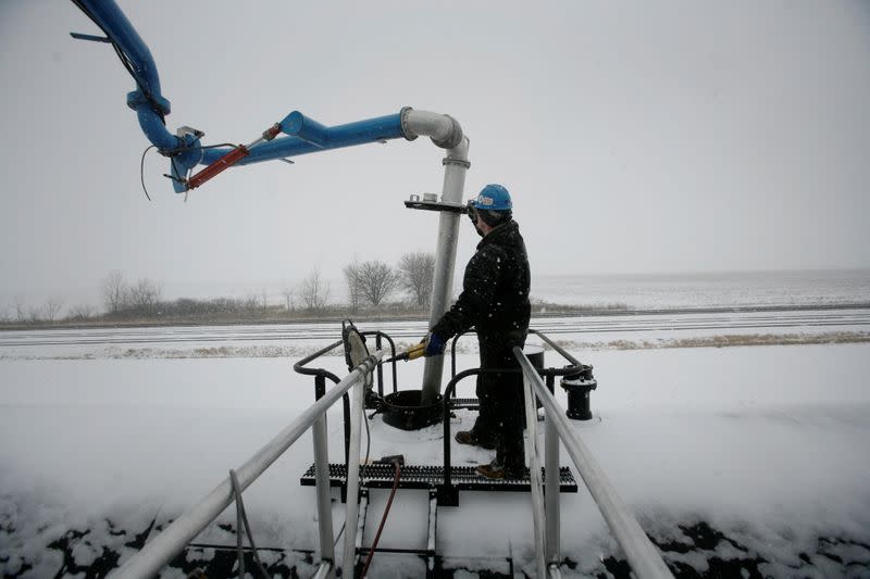 FILE PHOTO: Slade Whetro loads a rail tank car with Ethanol at the Lincolnway Energy plant in Nevada, Iowa