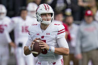 Wisconsin quarterback Graham Mertz (5) looks to pass against Purdue during the first half of an NCAA college football game in West Lafayette, Ind., Saturday, Oct. 23, 2021. (AP Photo/Michael Conroy)